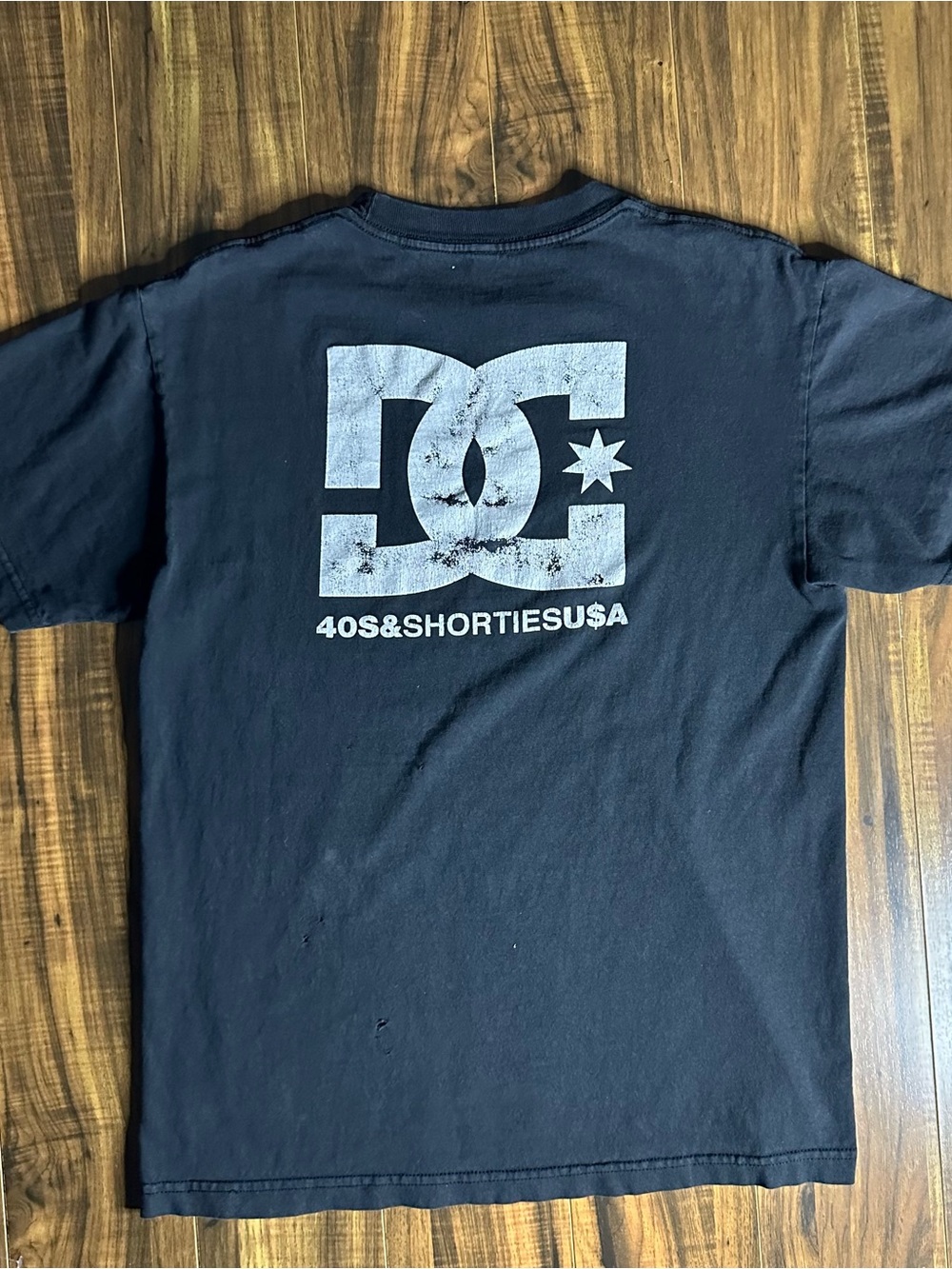 DC Black Tee with Subtle White Neck Logo